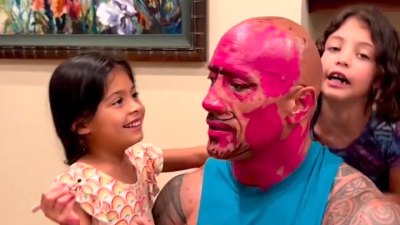 Dad makeover!  Dwayne Johnson's kids hilariously cover his face in lipstick