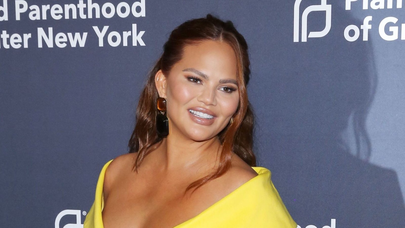 Chrissy Teigen Assures Critics That Her Daughter Is ‘Safe’ After Getting Called Out for Not Using Baby Carrier 'Right' Promo: Chrissy Teigen Responds to Critic