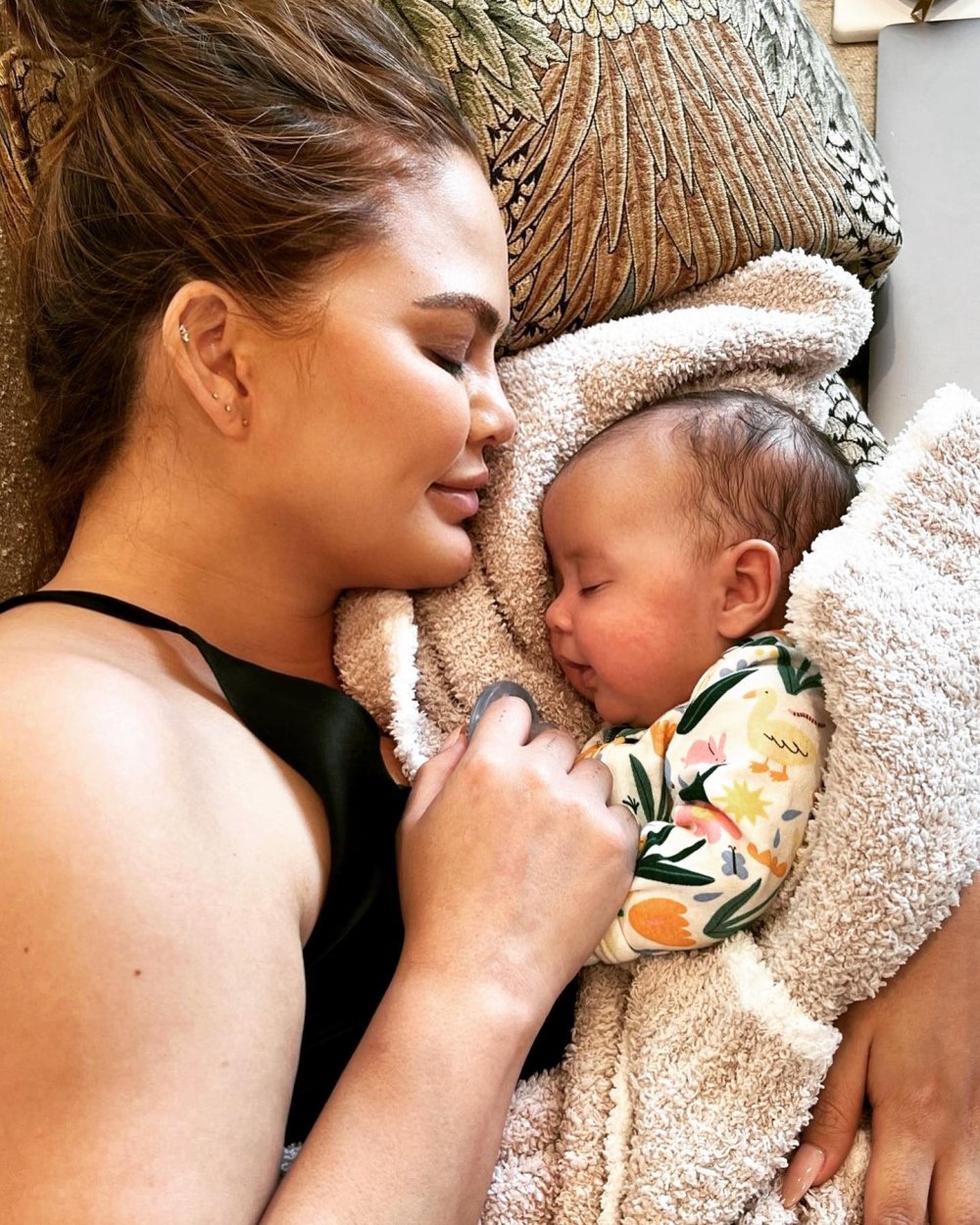 Chrissy Teigen Embraces Lifetime Scars and Body Imperfections While Sitting Nude in the Bath With Daughter Esti 2
