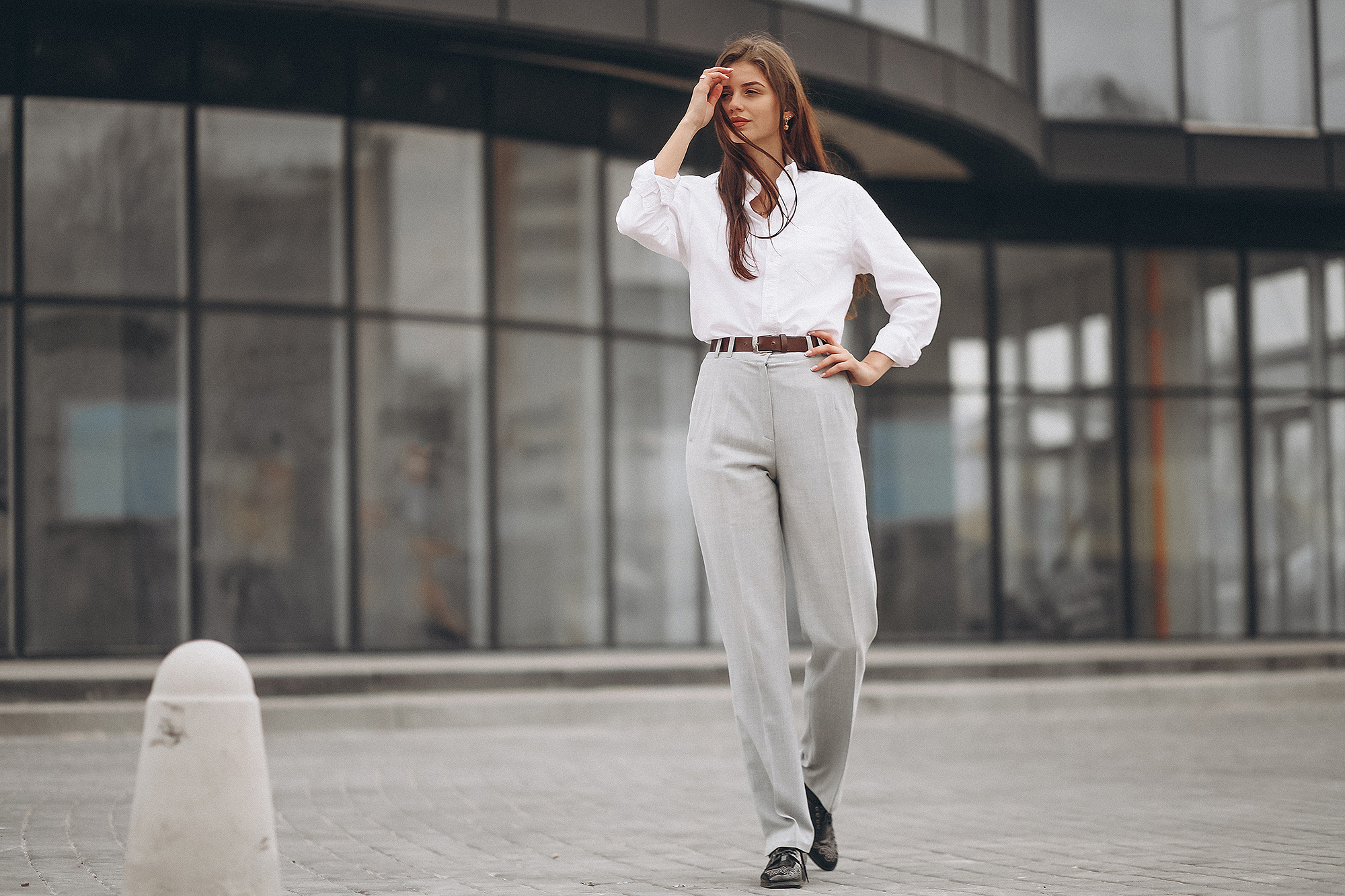 A Beautiful Confident Business Lady Dressed In A Casual White Shirt And  Black Pants Walking Around The Office And Looking Around Exploring New  Coworking Space Stock Photo  Download Image Now  iStock