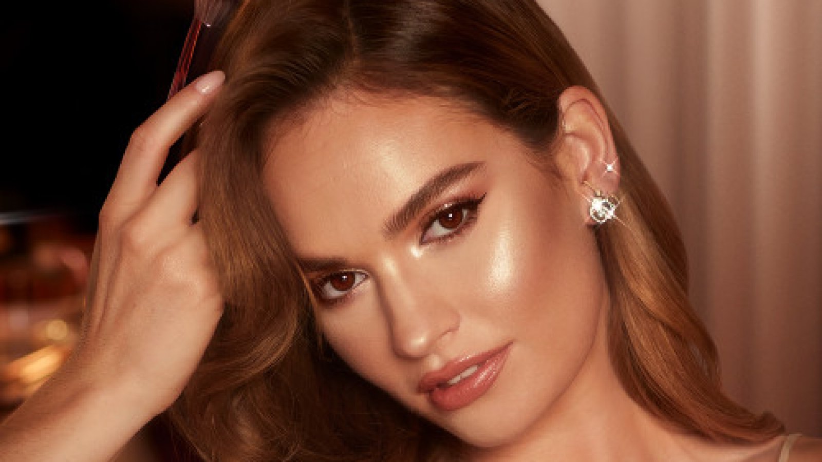 Lily James in Charlotte Tilbury highlighter