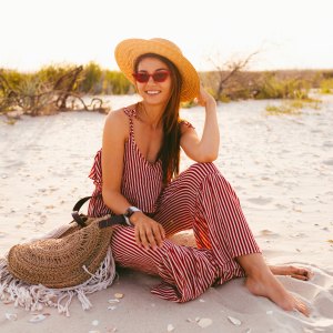 Woman-Wearing-Romper-At-Beach-Stock-Photo