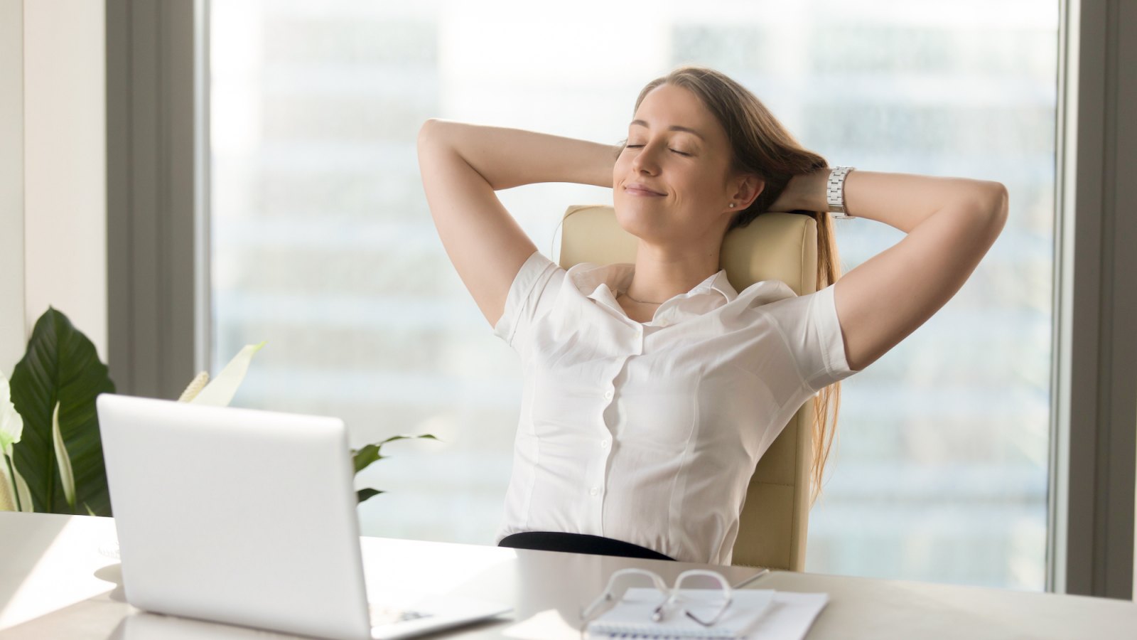 Woman-Without-Stress-At-Work-Desk-Stock-Photo