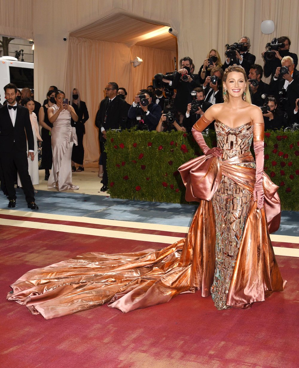 Feature Blake Lively Hops Over an Exhibit Rope to Fix Her Iconic Met Gala Dress