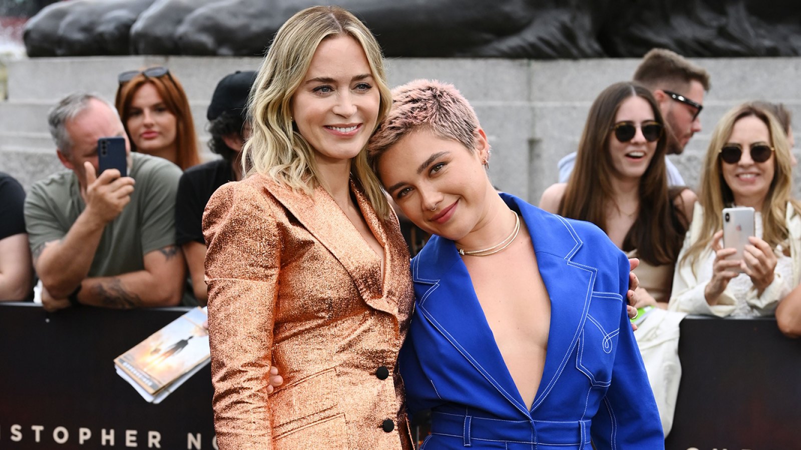 Florence Pugh Saves Emily Blunt From a Wardrobe Malfunction at ‘Oppenheimer’ Premiere