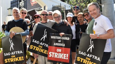 Aaron Paul Bryan Cranston Join Breaking Bad Writer on Strike