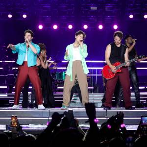 See The Jonas Brothers Groovy Style on ‘The Tour’: From Sheer Shirts to Sequin Pants