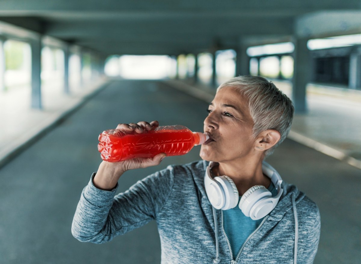 woman drinking hydration drink