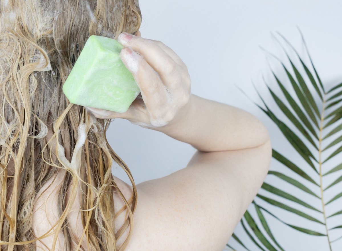 Woman washing her hair with a shampoo bar