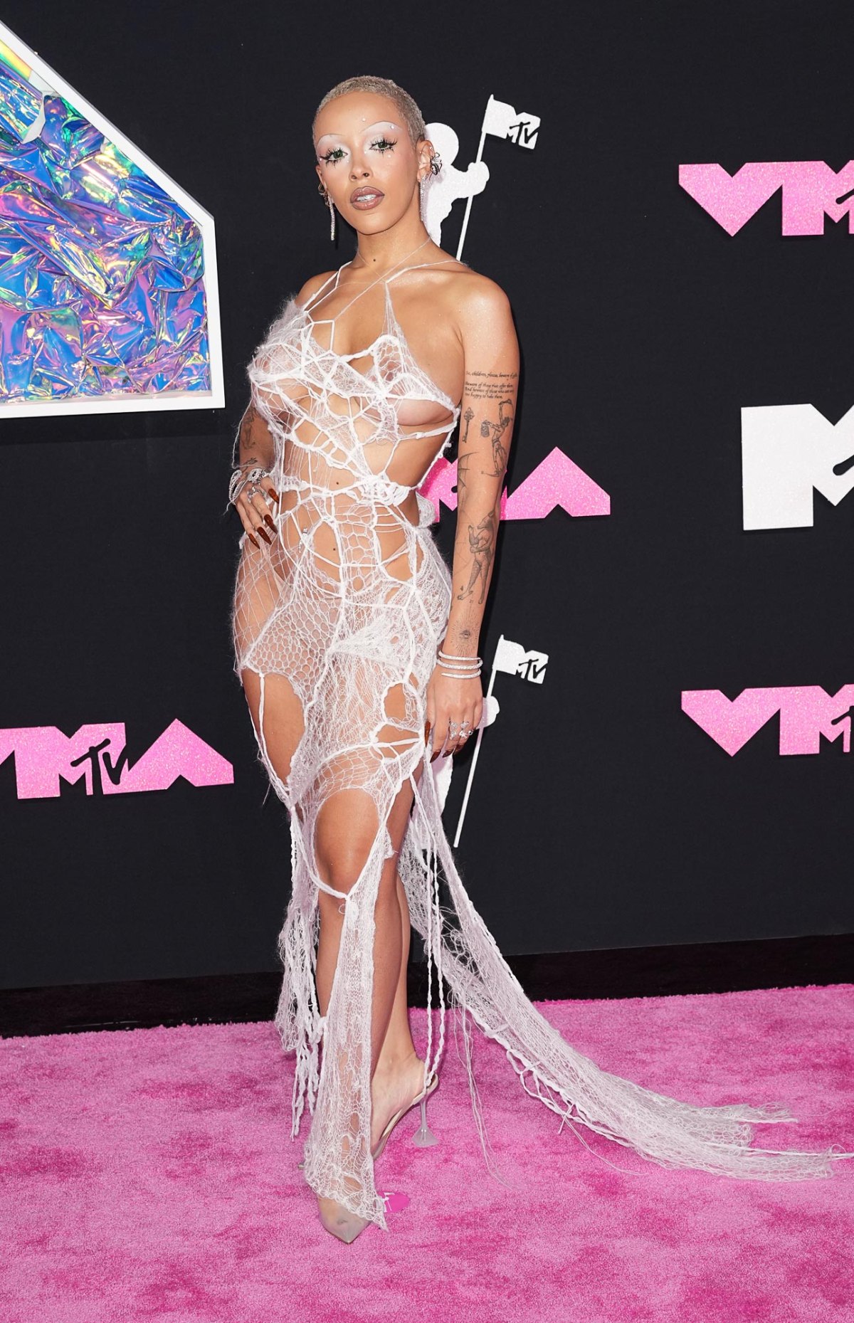 Doja Cat Covers Her Curves in a Spider Web at the 2023 MTV VMAs UsWeekly