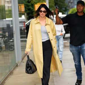 Kendall Jenner Brings Sunshine to a Rainy Day in Chic Yellow Coat