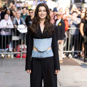 Anne Hathaway Steps Out In Denim Pantsuit To Promote New Movie