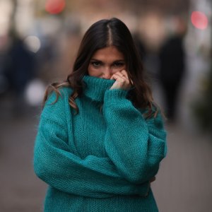 Woman in cozy turtleneck sweater