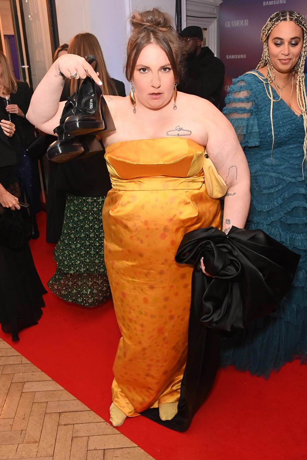 Lena Dunham Ditches Shoes, Wears Just Socks at Glamour Women of the Year Awards