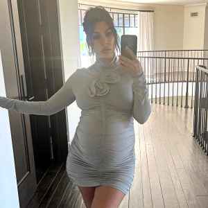 Pregnant Kourtney Kardashian Nearly Bares All in Sheer Bra and Thong While Showing Off Baby Bump