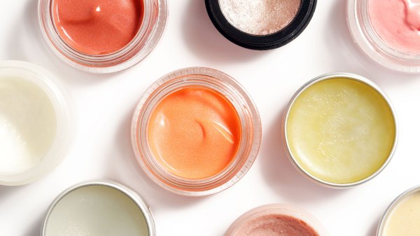 Creamy make up products - top view of decorative cosmetic containers isolated on white backgroiunds