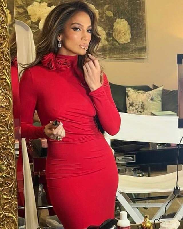 Jennifer Lopez shows off the striking red dress she wore to the annual holiday party with Ben Affleck 410