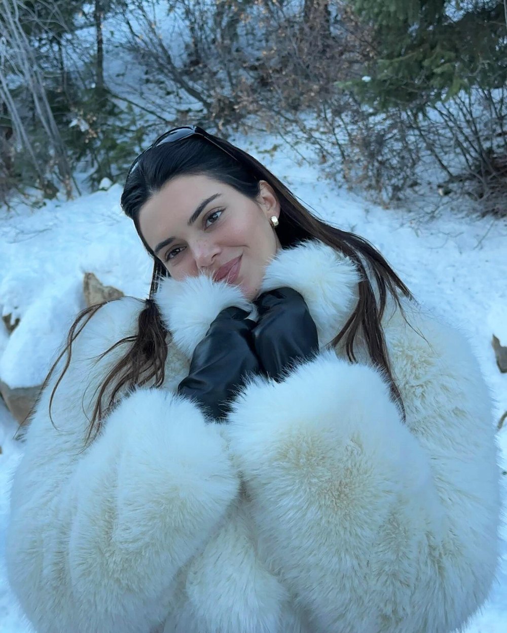 Kendall Jenner Dons a Soft Smile While Keeping Warm in a White Fur Coat in Aspen