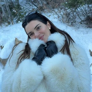 Kendall Jenner Dons a Soft Smile While Keeping Warm in a White Fur Coat in Aspen
