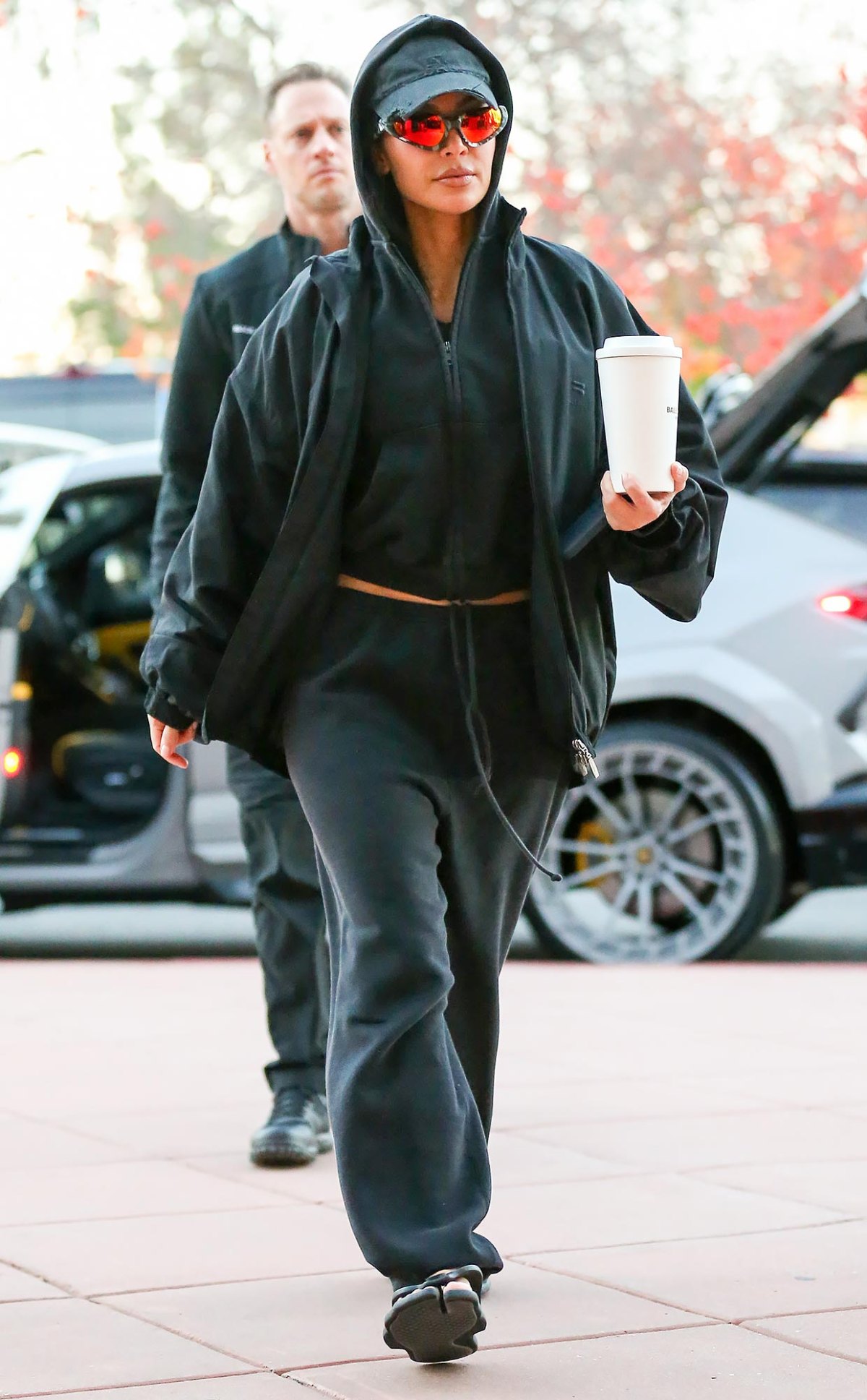 Kim Kardashian Pairs Her Cozy Fall Sweatsuit With Flip-Flops | Us Weekly