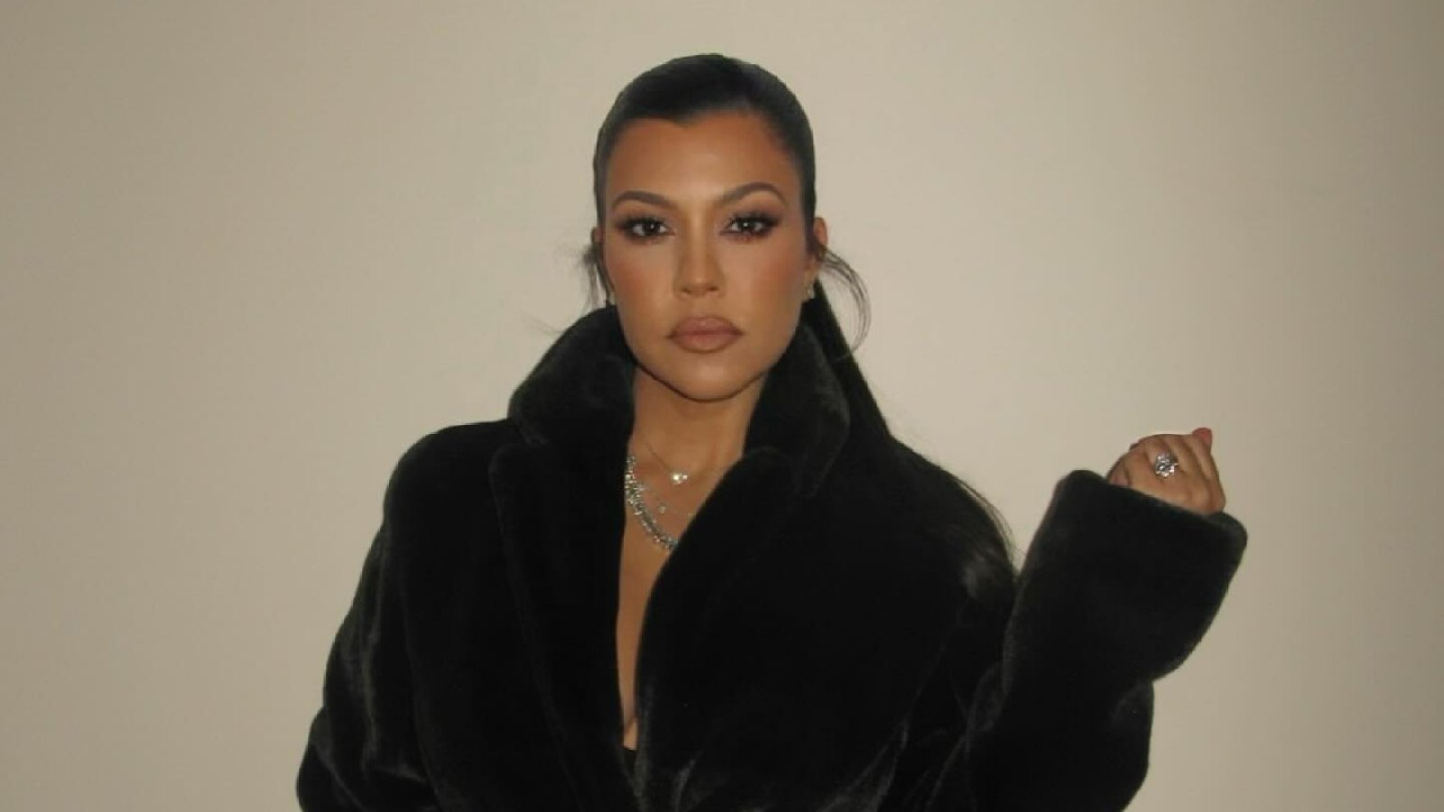 FEATURE Kourtney Kardashian Threw on a Cozy Coat for Christmas Because Her Boobs Are Filled With Milk
