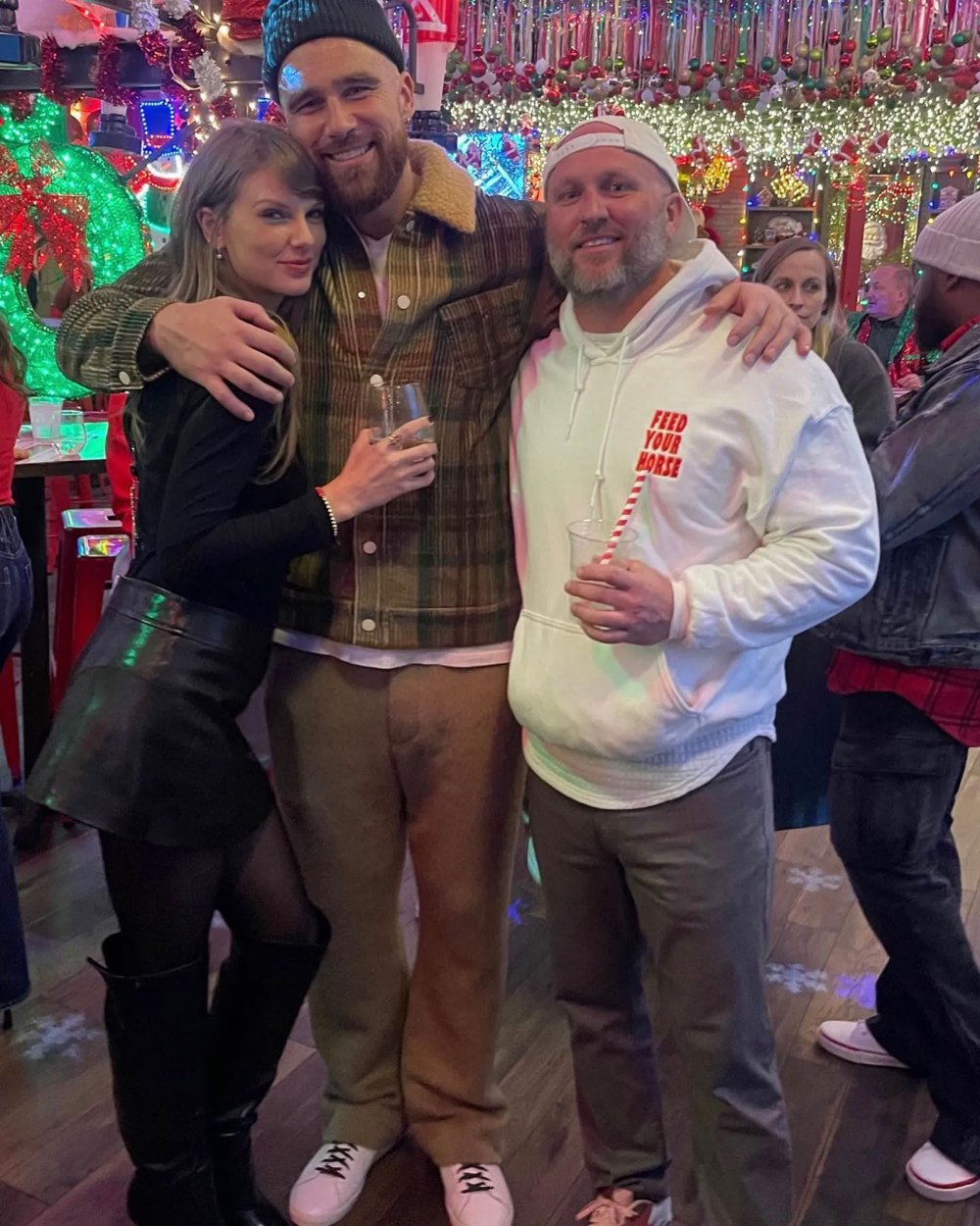 Taylor Swift Adorably Wears Trav Bracelet at Holiday Party With Travis Kelce