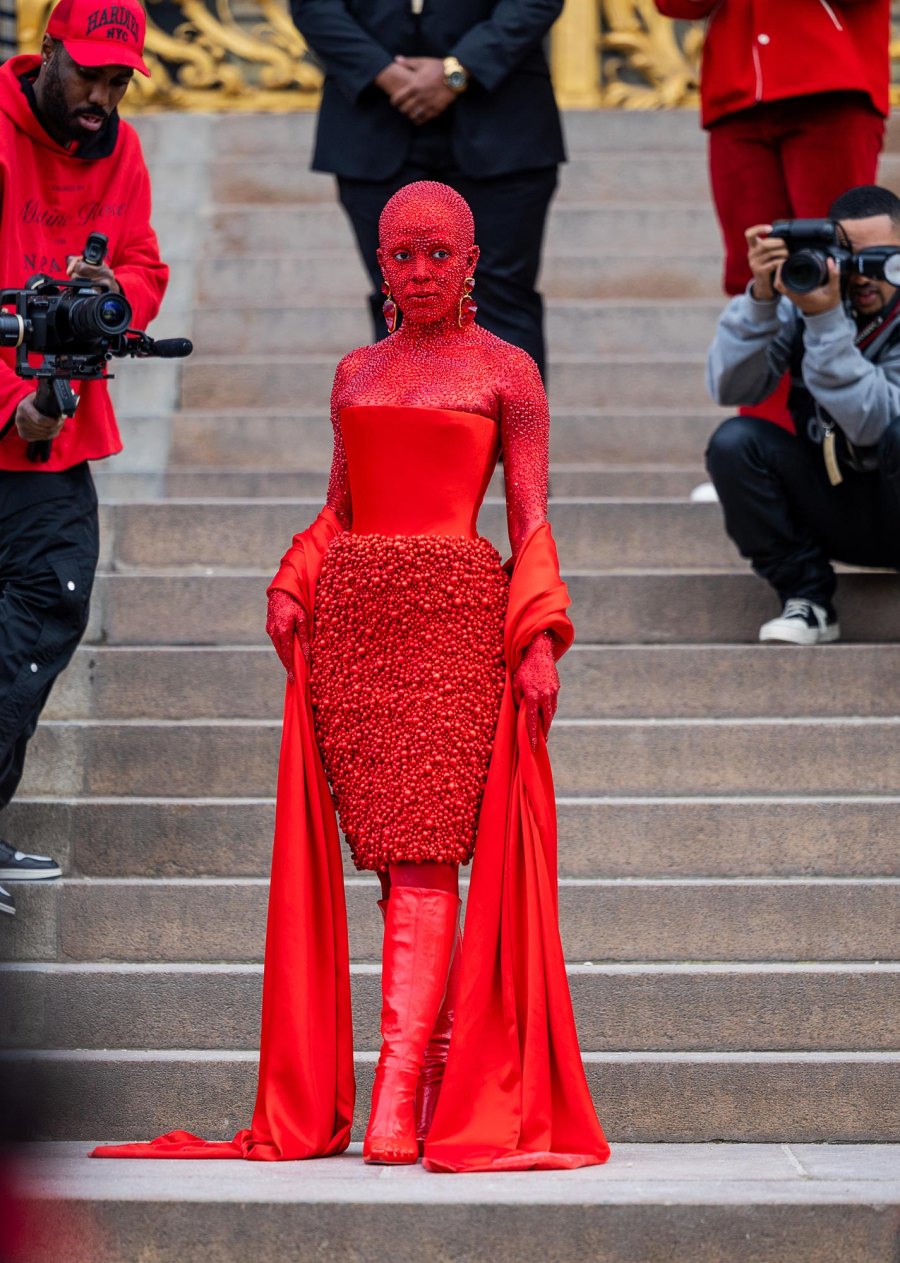 The Fiercest Fashion Risk Takers of 2023 Rihanna Cardi B Harry Styles and More 114 Doja Cat wears red off shoulder dress, red boots outside Schiaparelli during Paris Fashion Week