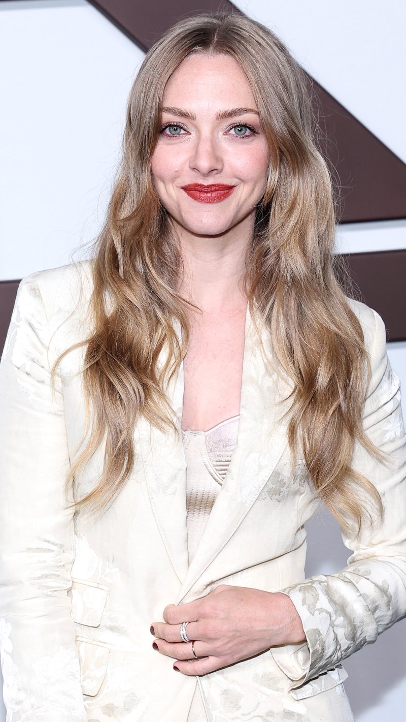 Amanda Seyfried Looking at camera Smiling wearing cream colored blazer and matching top