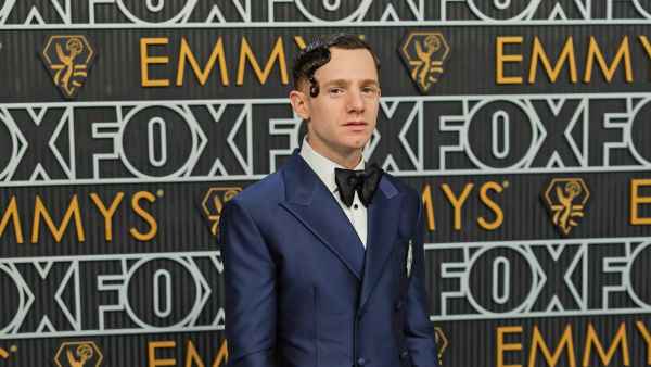 Chris Perfetti Sports Artfully Gelled Hair and a Sharp Navy Suit at the 2023 Emmys