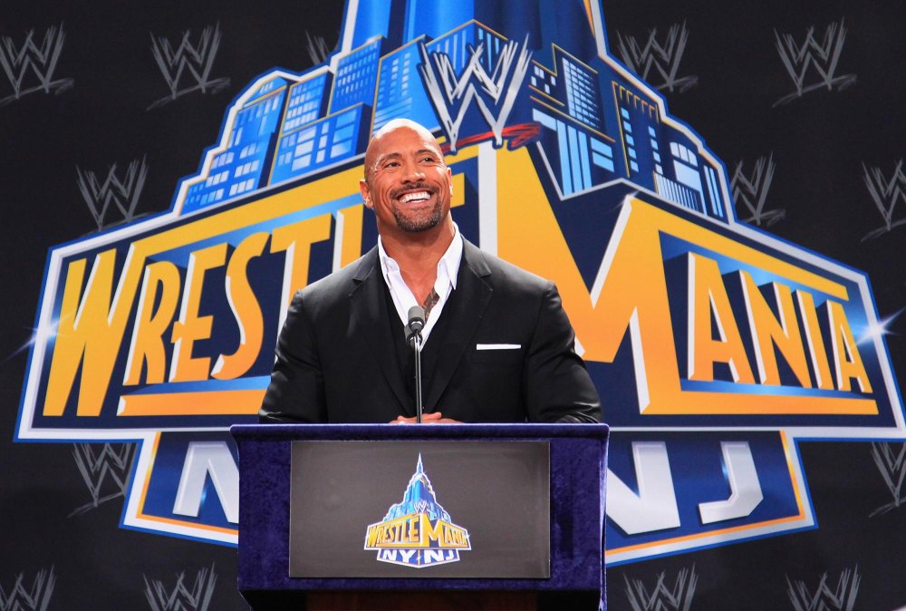 Dwayne Johnson toasts his movie Baywatch while talking during his WWE Return 693