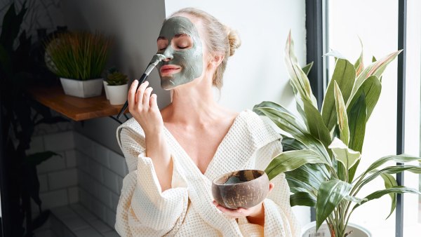 Woman enjoying skin care treatment at home