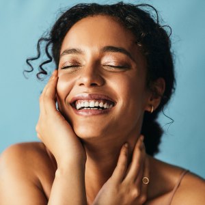 Cropped shot of a beautiful young woman posing against a grey background