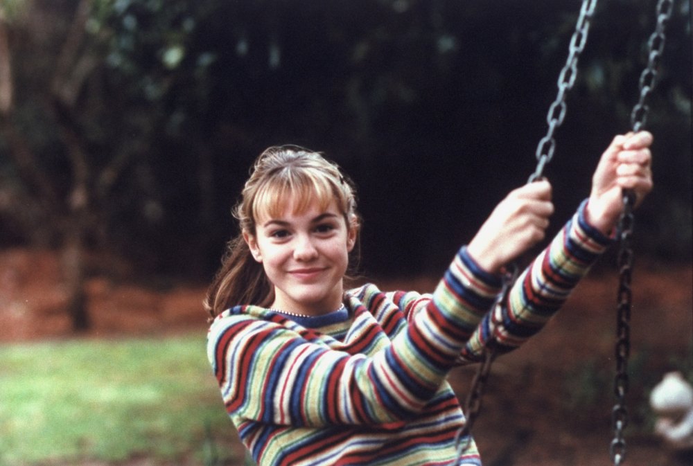Actress Larisa Oleynik on a swing in her backyard, Larisa Oleynik