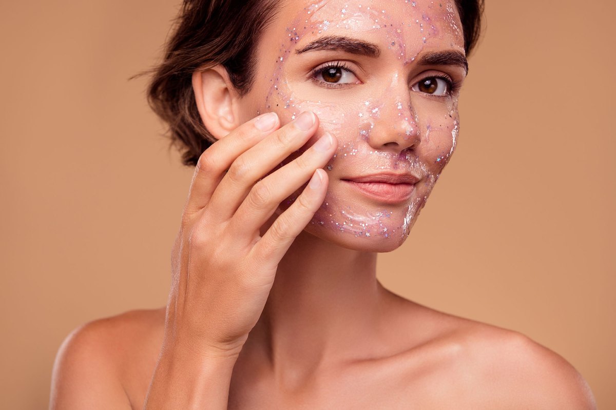 Photo of attractive lady touch applying new face mask on daily morning hygiene for soft skin on pastel background.