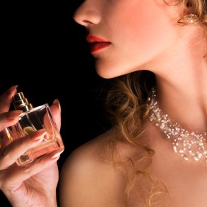 Woman holding perfume