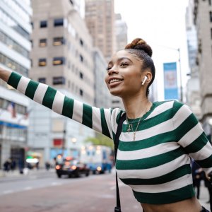 Woman wearing a striped long sleeve crop top
