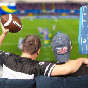 Father and son watching football