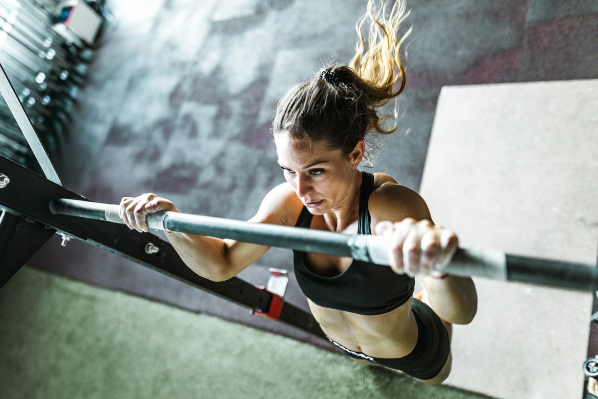 Woman exercising with chin-ups