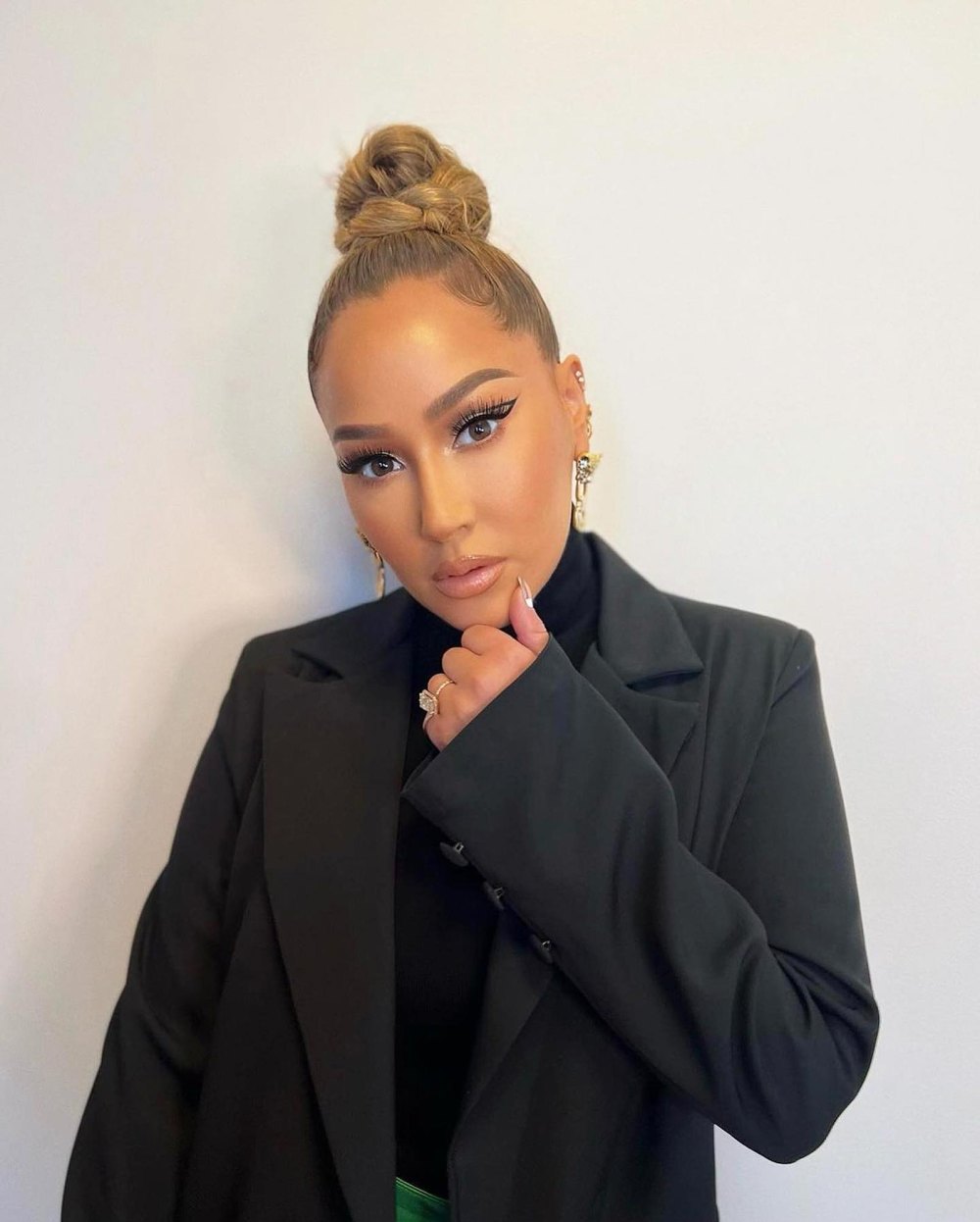 Adrienne Bailon Houghton reveals her beauty hacks and the Y2K trend she hopes is gone for good