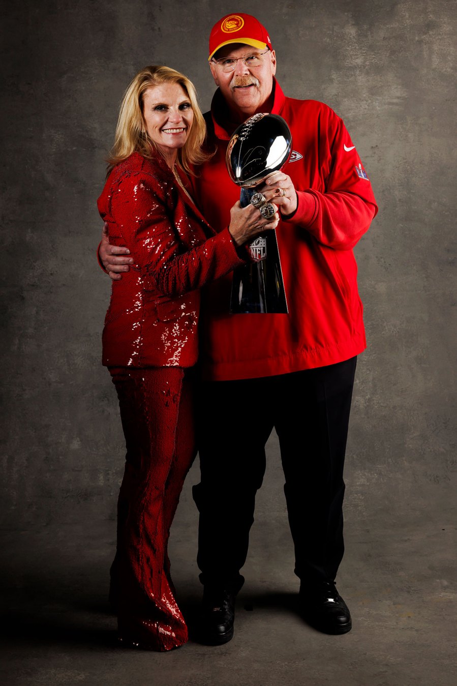 Andy Reid and Tammy Reid Kansas City Chiefs Players Kiss Vince Lombardi Trophy in Super Bowl LVIII Winners Portraits
