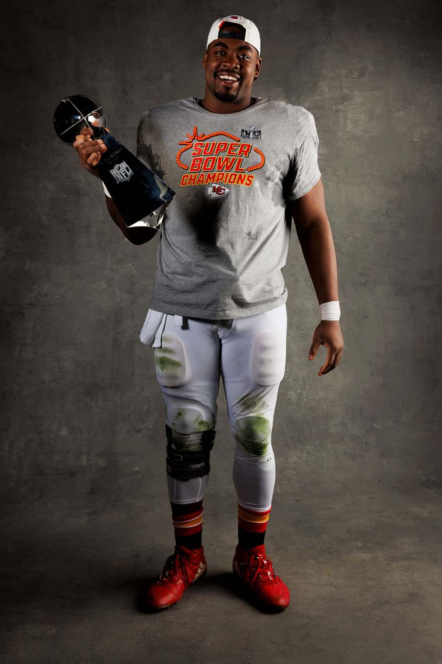 Chris Jones Kansas City Chiefs Players Kiss Vince Lombardi Trophy in Super Bowl LVIII Winners Portraits