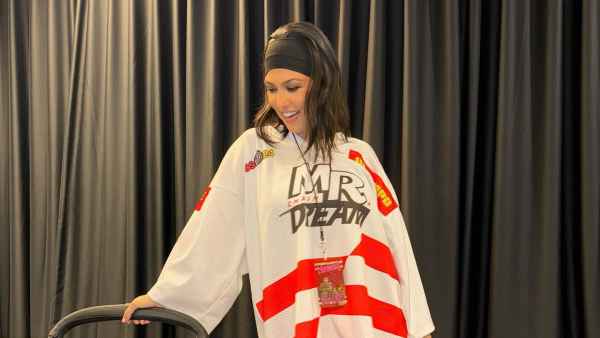 Kourtney Kardashian Embraces the Chaos at Travis Barker Concert in a Hockey Jersey and Heels