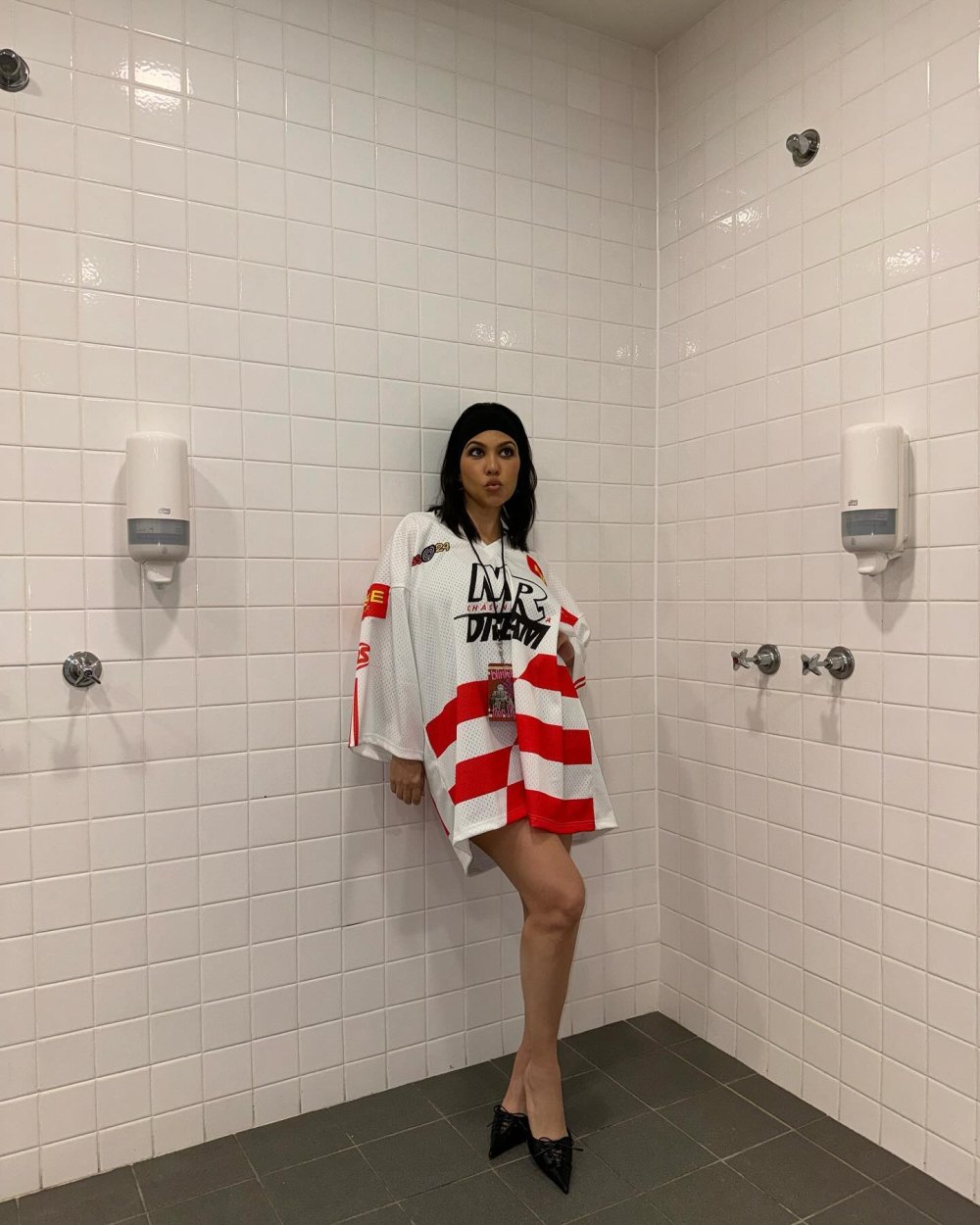 Kourtney Kardashian Embraces the Chaos at Travis Barker Concert in a Hockey Jersey and Heels