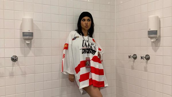Kourtney Kardashian Embraces the Chaos at Travis Barker Concert in a Hockey Jersey and Heels