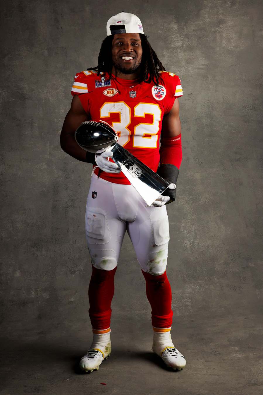 Nick Bolton Kansas City Chiefs Players Kiss Vince Lombardi Trophy in Super Bowl LVIII Winners Portraits