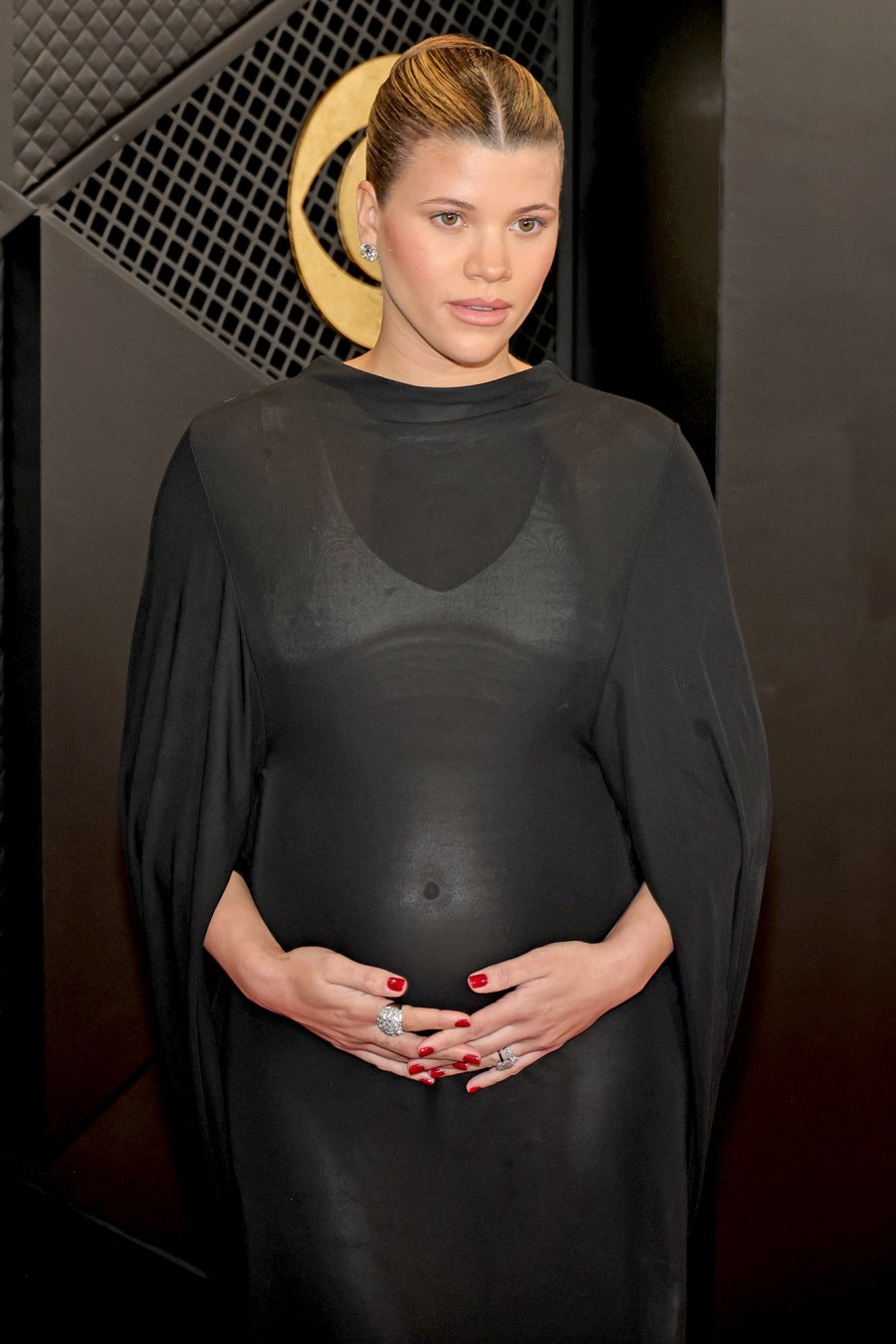 Pregnant Sofia Richie Cradles Her Bump at the Grammys