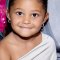 Stormi Webster Smiles in White Dress