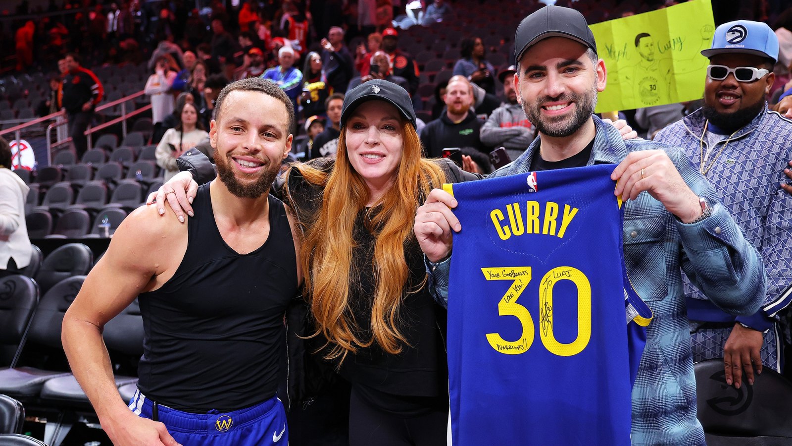 Steph Curry and Lindsay Lohan Have Sweet Interaction at Golden State Warriors Game