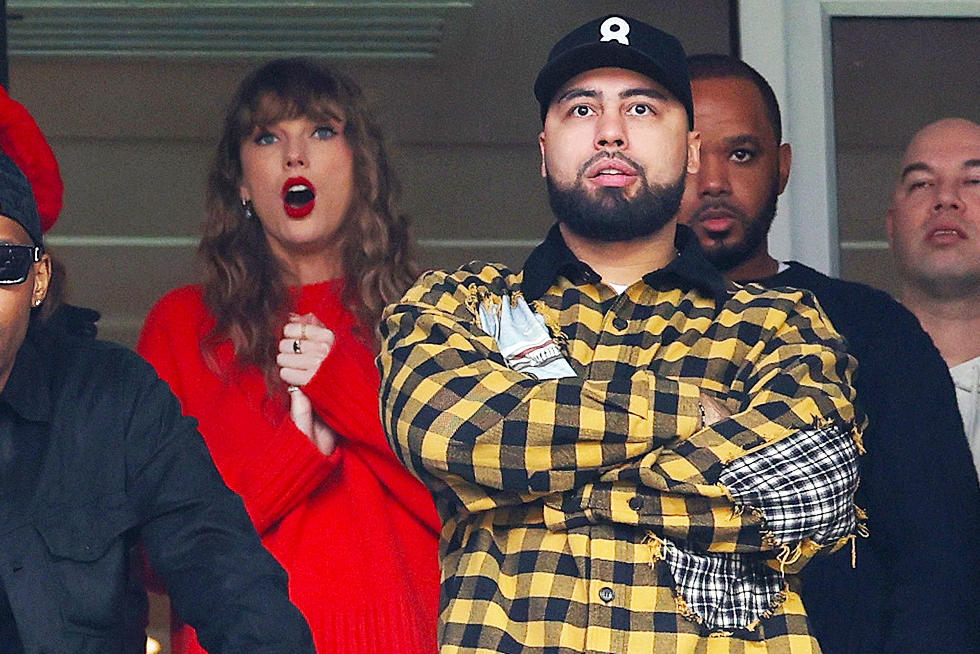 Taylor Swift Seems to Encourage Travis Kelce's Pal Ross to Feed Lion at Zoo