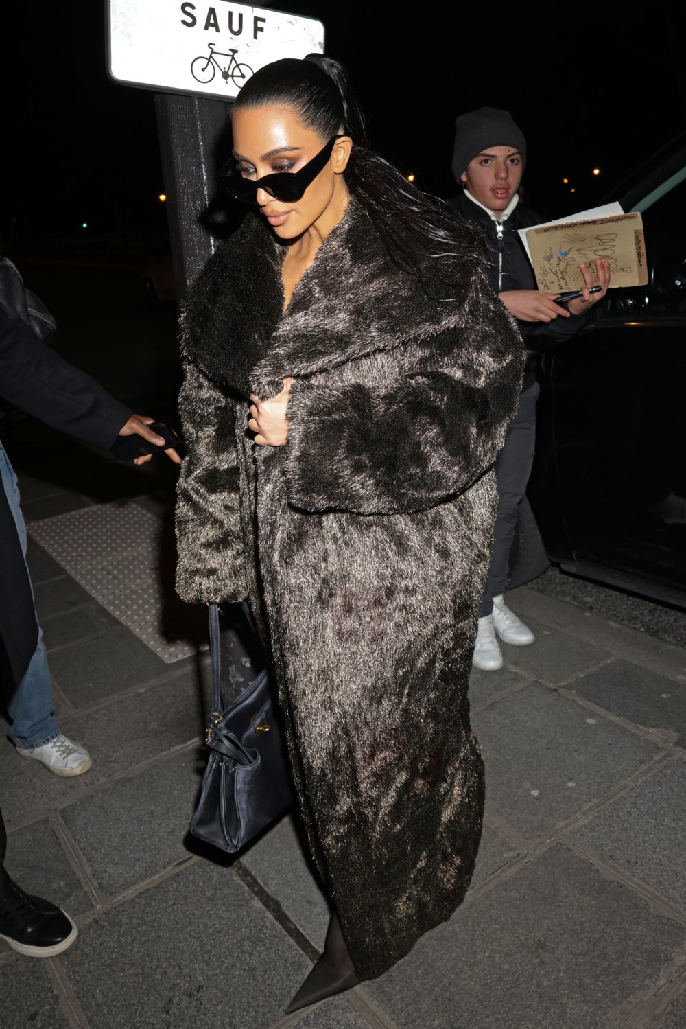 Kim Kardashian Steps out In 2 Back-To-Back Fur Coats During Paris Fashion Week
